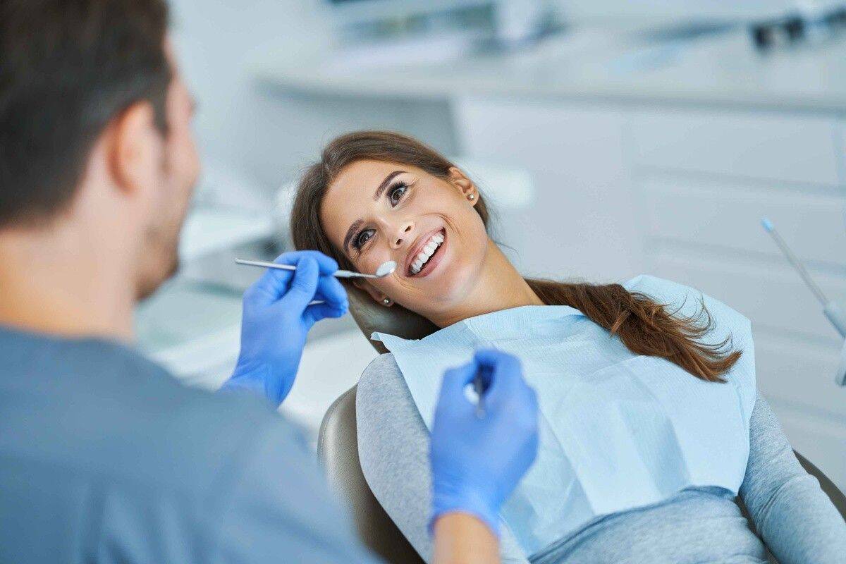 Patient receiving a gum health evaluation during a periodontal dental visit